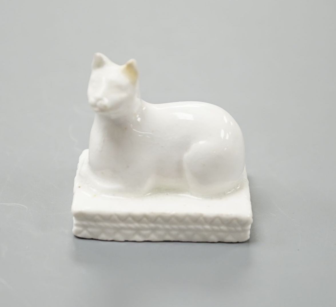 A Derby porcelain model of a cat recumbent on a cushion base, c.1810–25, 3.6 cm long, Cf. Dennis G.Rice, Cats in English porcelain, a variant of colour plate 21., Provenance: Dennis G.Rice collection